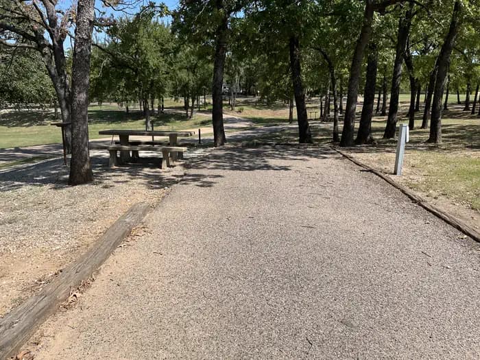 A photo of Site 12 of Loop JCRE at JOHNSON CREEK with Picnic Table, Electricity Hookup, Shade, Water Hookup
