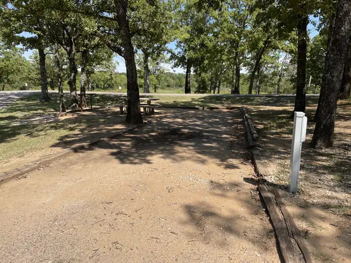A photo of Site 04 of Loop JCRE at JOHNSON CREEK with Picnic Table, Electricity Hookup, Fire Pit, Shade, Water Hookup