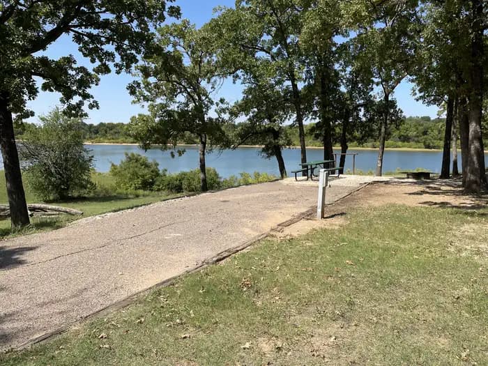 A photo of Site 07 of Loop JCRE at JOHNSON CREEK with Picnic Table, Electricity Hookup, Fire Pit, Waterfront, Water Hookup