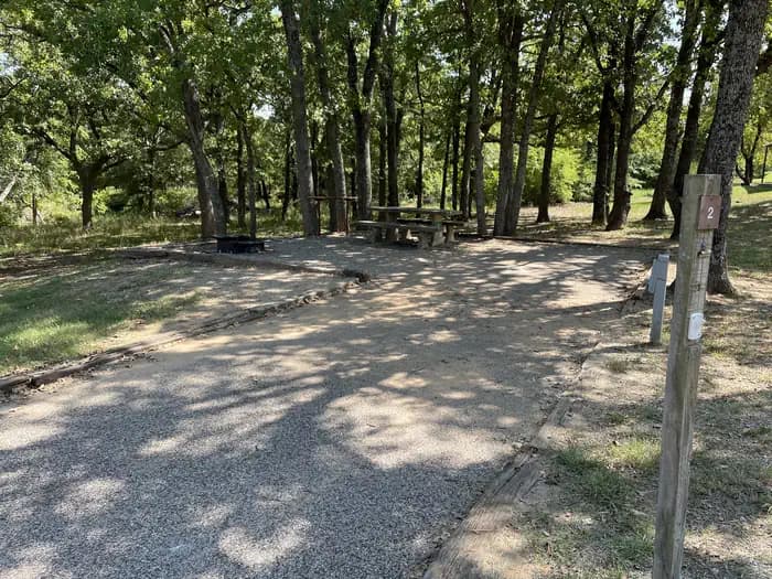 A photo of Site 02 of Loop JCRE at JOHNSON CREEK with Picnic Table, Electricity Hookup, Fire Pit, Shade, Water Hookup