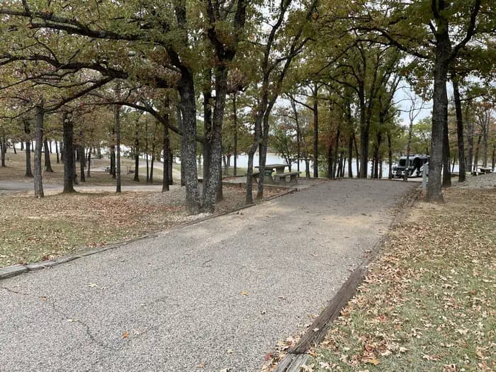 A photo of Site 34 of Loop JCRE at JOHNSON CREEK with Picnic Table, Electricity Hookup, Fire Pit, Shade, Water Hookup
