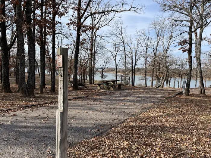 A photo of Site 32 of Loop JCRE at JOHNSON CREEK with Picnic Table, Electricity Hookup, Fire Pit, Shade, Water Hookup