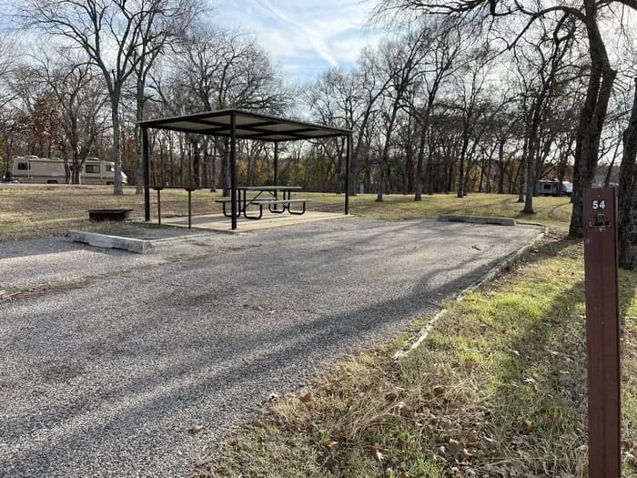 A photo of Site 54 of Loop JCRE at JOHNSON CREEK with Picnic Table, Electricity Hookup, Fire Pit, Shade