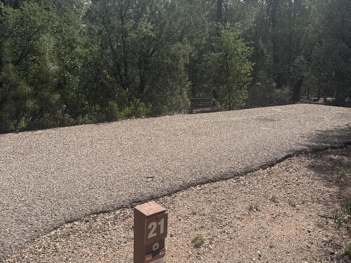 Houston Mesa, Elk Loop site #21 featuring large camping space with picnic table and fire pit.
